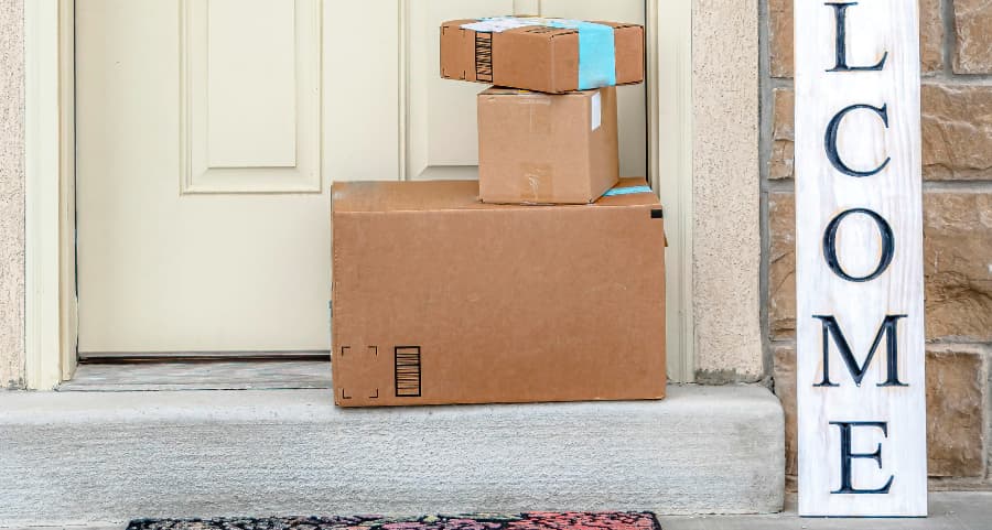 Boxes by the door of a residence with a welcome sign in Killeen